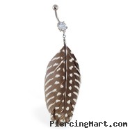 Belly ring with dangling brown and white spotted feather