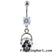 Navel ring with dangling skull with headphones