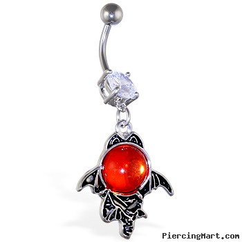 Navel ring with large dangling red stone with bat wings