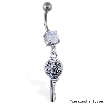 Navel ring with dangling key with multiple skulls